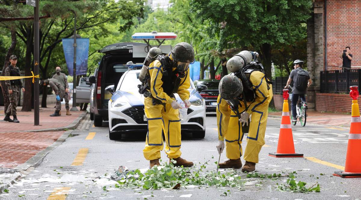 South Korean army soldiers wearing protective gear checks the debreis from a balloon presumably sent by North Korea, Wednesday, July 24, 2024, in Seoul, South Korea.