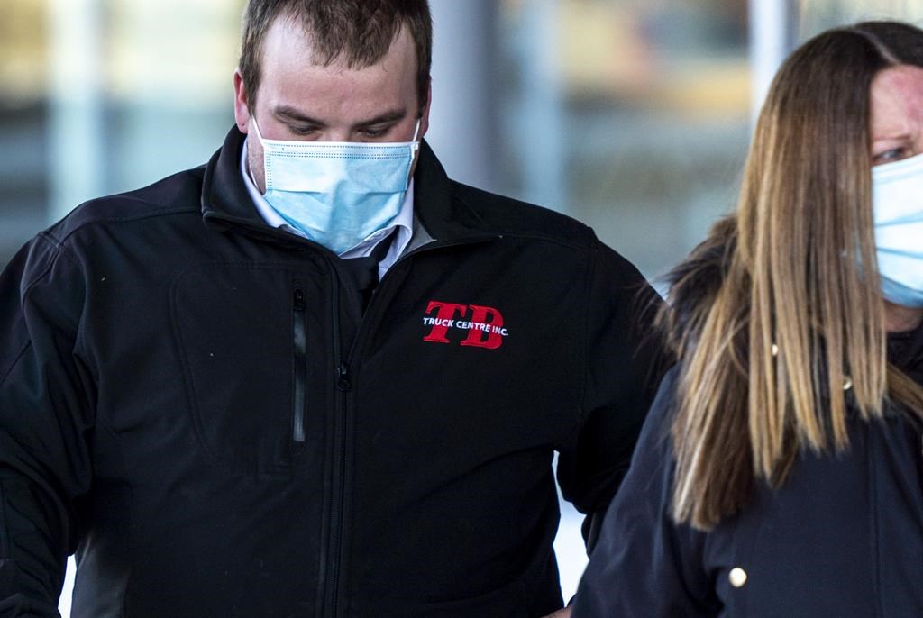 Day parole was revoked for Brayden Bushby, a man serving a manslaughter sentence for the death of an Indigenous woman. Bushby, left, departs the courthouse with his mother after his sentencing hearing after being found guilty of manslaughter in the death of Barbara Kentner, in Thunder Bay, Ont., on Wednesday February 17, 2021. 