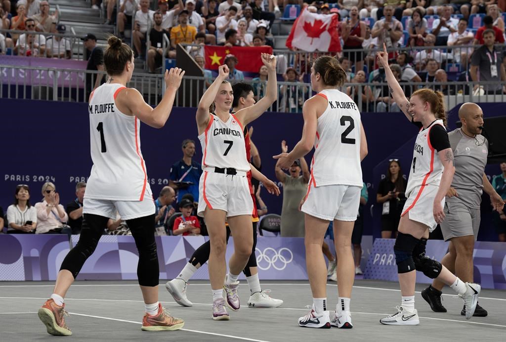 Canada fell to 3-2 in Olympic women's 3x3 basketball play following an 18-17 loss to the United States on Friday. Michelle Plouffe (left to right), Paige Crozon, Katherine Plouffe and Kacie Bosch celebrate after defeating China in 3x3 basketball competition at the Summer Olympics, Wednesday, July 31, 2024 in Paris. THE CANADIAN PRESS/Adrian Wyld.