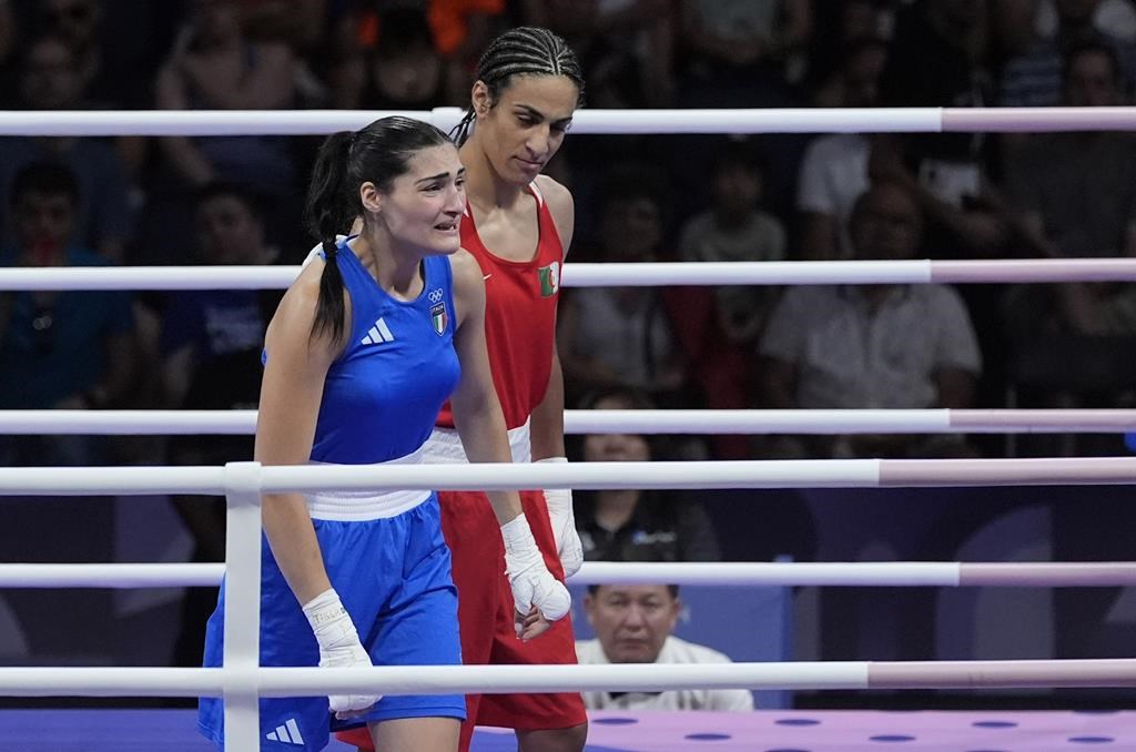 Algeria's Imane Khelif, right, defeated, Italy's Angela Carini in their women's 66kg preliminary boxing match at the 2024 Summer Olympics, Thursday, Aug. 1, 2024, in Paris, France.