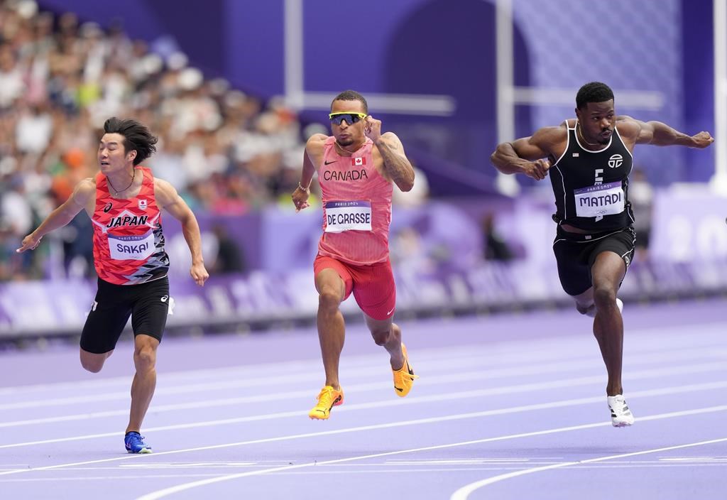 Canada's Andre De Grasse, centre, competes in the men's men's 100 meters round 1 heat at the 2024 Summer Olympics, Saturday, Aug. 3, 2024, in Saint-Denis, France.
THE CANADIAN PRESS/Nathan Denette.
