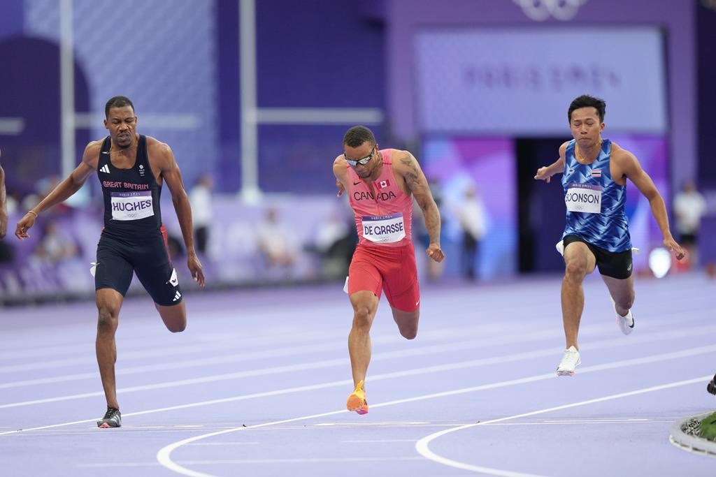 <p>Sprinter Andre De Grasse, centre, competes in the men’s 100m semifinals at the 2024 Summer Olympics, Sunday, Aug. 4, 2024, in Saint-Denis, France. The six-time Olympic medallist from Markham, Ont., finished fifth in the third semifinal heat of the men's 100 metres. It's the first time De Grasse failed to qualify for an Olympic final, with it being his third appearance at the Games. THE CANADIAN PRESS/Nathan Denette</p>.