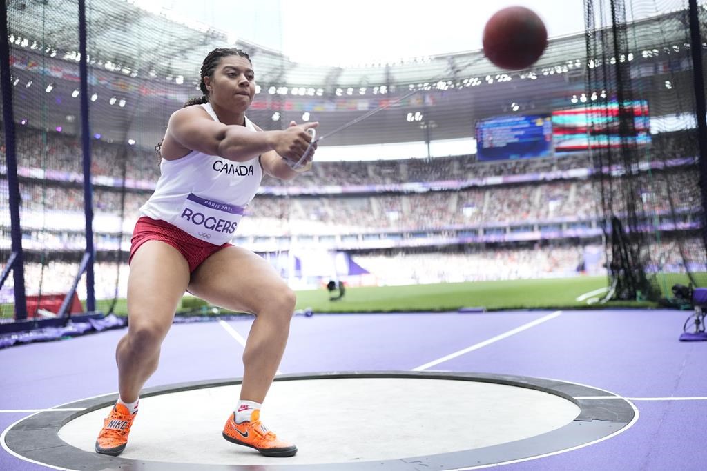 Camryn Rogers of Canada competes in the women's hammer throw qualification at the 2024 Summer Olympics, Sunday, Aug. 4, 2024, in Saint-Denis, France. From high hopes for a hammer throwing sweep to a highly anticipated showdown on the hardwood, here are five things to look out for at the Paris Olympics on Tuesday, Aug. 6. THE CANADIAN PRESS/AP/Bernat Armangue.