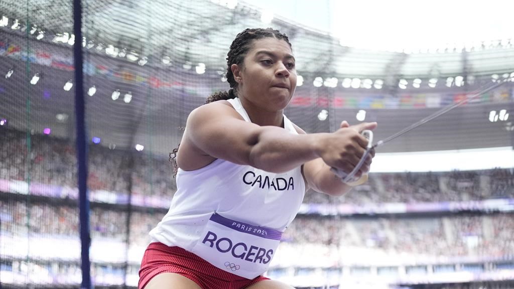 Camryn Rogers of Canada competes in the women's hammer throw qualification at the 2024 Summer Olympics, Sunday, Aug. 4, 2024, in Saint-Denis, France. After Ethan Katzberg won the men’s hammer throw at the Paris Olympics, it’s Rogers’ turn to go for gold in the women’s.THE CANADIAN PRESS/AP/Bernat Armangue.