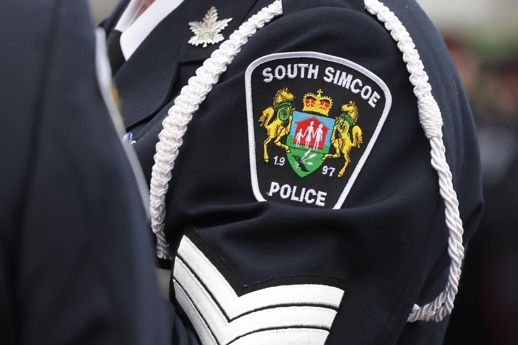 A substitute teacher has been arrested and charged in connection to an assault at a school in Bradford. A service patch is seen on the arm of a senior South Simcoe police officer at a funeral service in Barrie, Ont., Thursday, Oct. 20, 2020. 