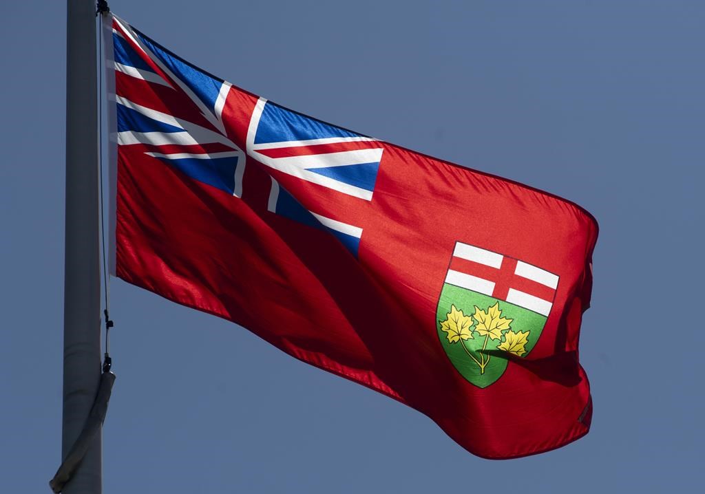 Ontario's provincial flag flies in Ottawa, Monday, July 6, 2020. The Mayor of an eastern Ontario city and five out of six municipal councillors are condemning the last member of the group for appearing on an online show they say promotes hate speech and extremist views, stating her increasingly controversial history has "created an environment of fear and intimidation" for the group. THE CANADIAN PRESS/Adrian Wyld.