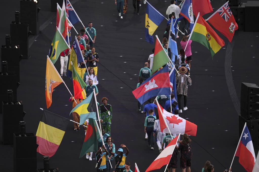 Flagbearers parade during the 2024 Summer Olympics closing ceremony at the Stade de France, Sunday, Aug. 11, 2024, in Saint-Denis, France. THE CANADIAN PRESS/AP-Dita Alangkara.