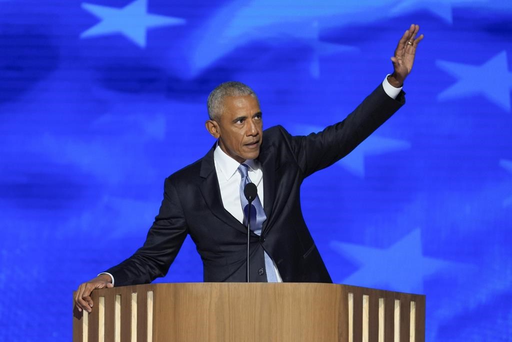 Former President Barack Obama gestures as he finishes speaking at the Democratic National Convention on Tuesday, Aug. 20, 2024, in Chicago.