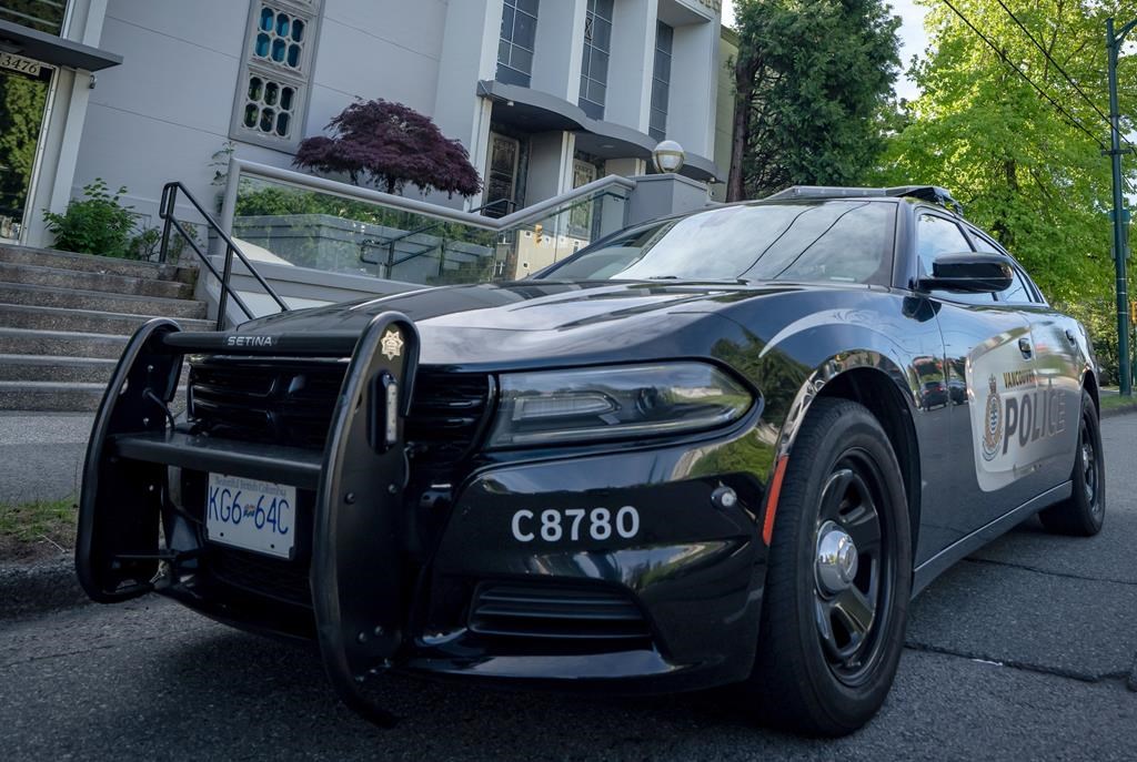 A Vancouver Police Department patrol car is shown in Vancouver, B.C. on May. 31. The Independent Investigations Office says the decision to charge a Vancouver Police officer for hitting a pedestrian on Commercial Drive last year is now with prosecutors. THE CANADIAN PRESS/Ethan Cairns.