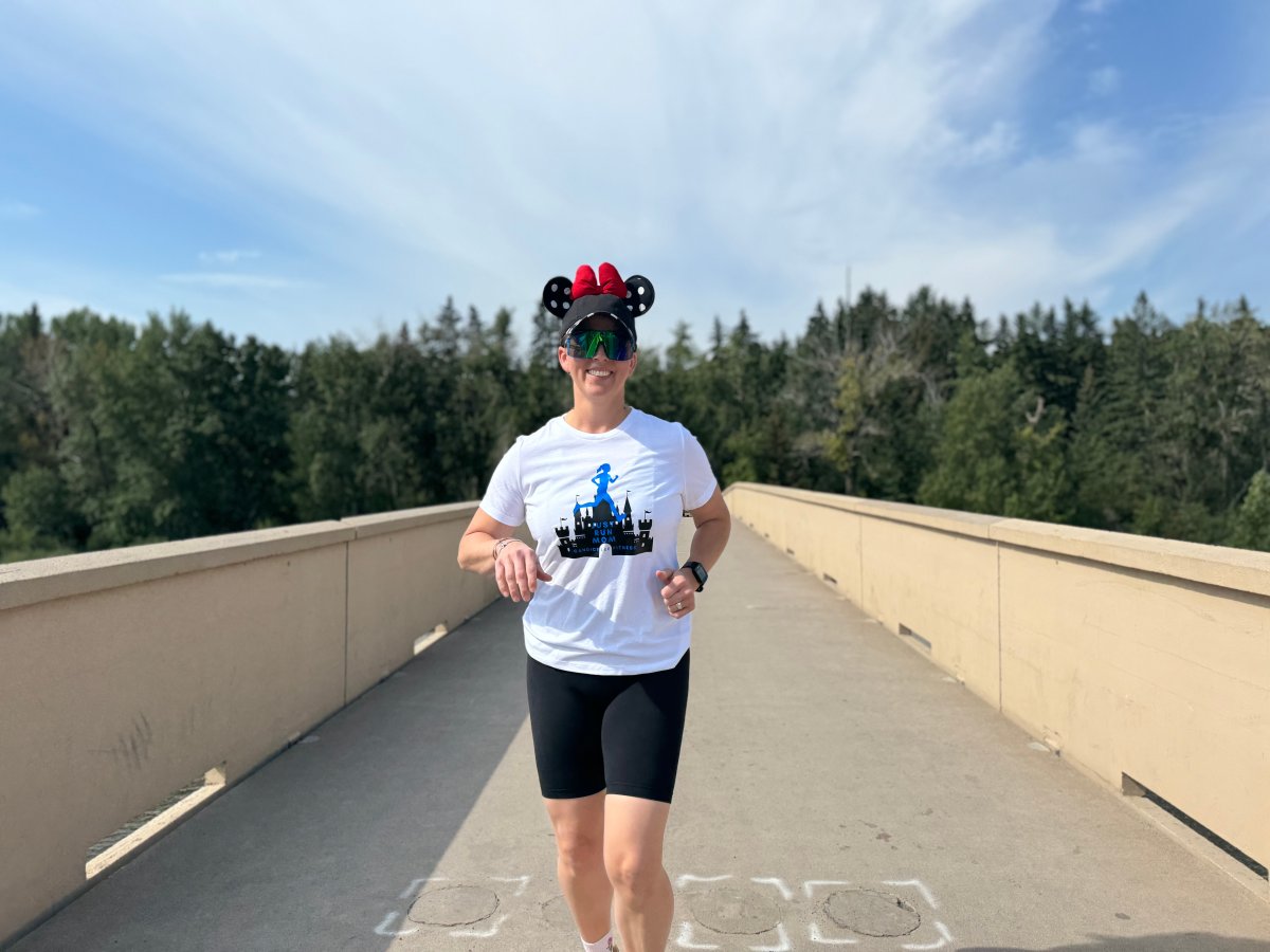 Candice Lee can be spotted in her Minnie Mouse ears while preparing for her race in Disneyland.