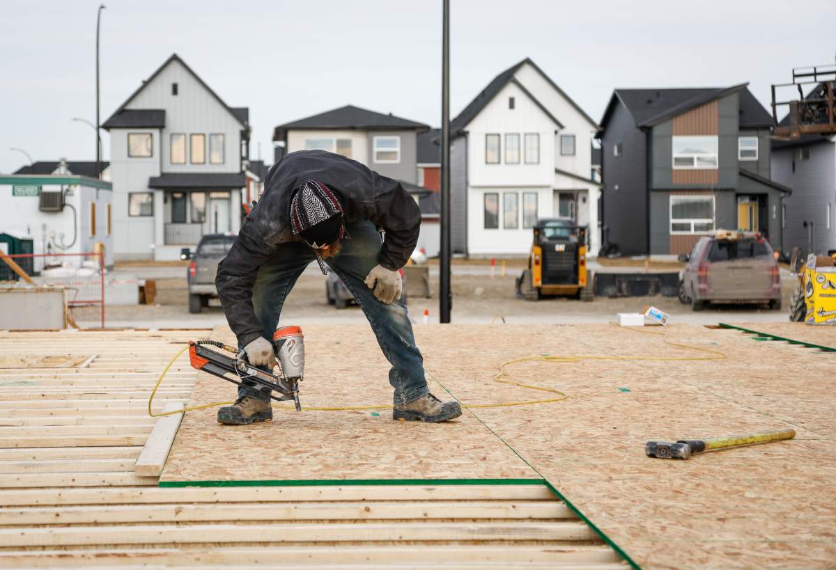 FILE: Framers work on a new house under construction in Airdrie, Alta.