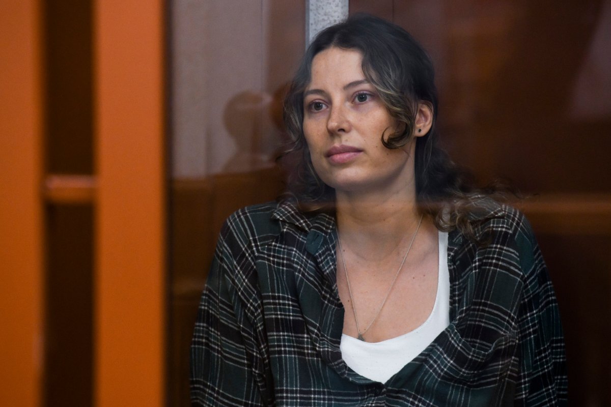 Ksenia Khavana sits in a defendant’s cage in a court in Yekaterinburg, Russia, on Thursday, June 20, 2024. 