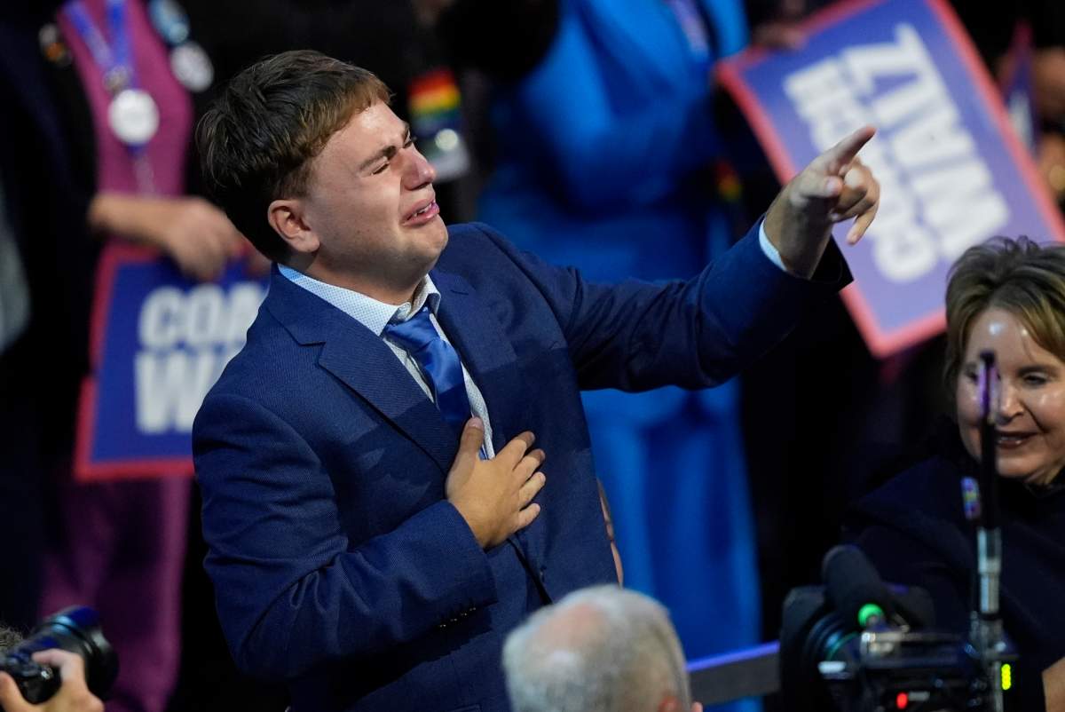 Gus Walz cries as his father Democratic vice presidential nominee Minnesota Gov. Tim Walz speaks during the Democratic National Convention Wednesday, Aug. 21, 2024, in Chicago.