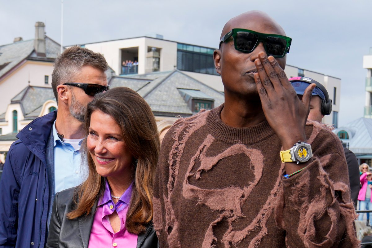 Norway's Princess Martha Louise and Durek Verret arrive at the boats that will transport them to Geiranger for their wedding celebration on Saturday.