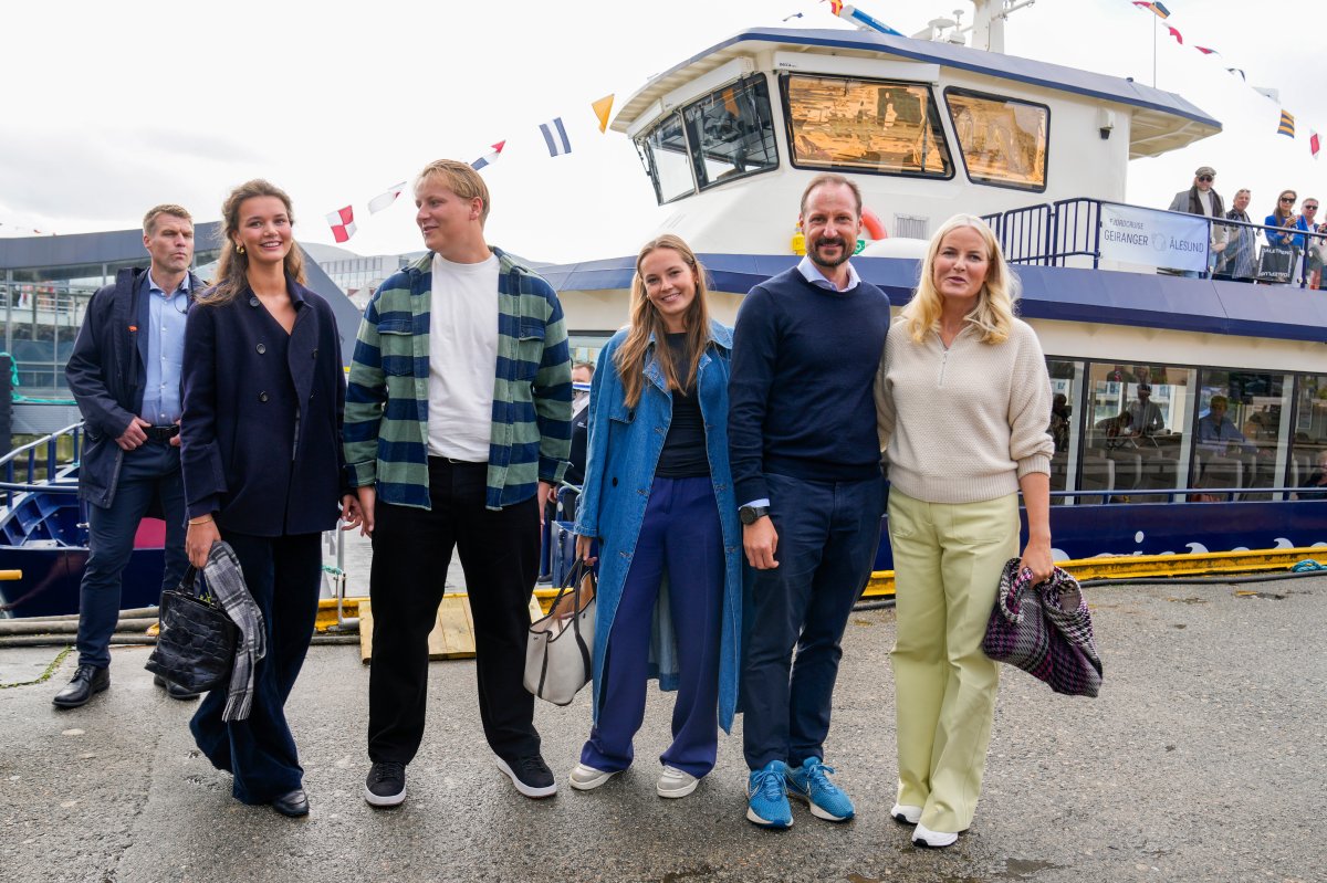 Norway's Crown Prince Haakon, 2nd right, and Crown Princess Mette-Marit, right, and their children Prince Sverre Magnus, Princess Ingrid Alexandra, center, arrive at the boats in Alesund, Norway, Friday Aug. 30, 2024, that will transport them to Geiranger for the wedding celebration of Princess Martha Louise and Durek Verret on Saturday.