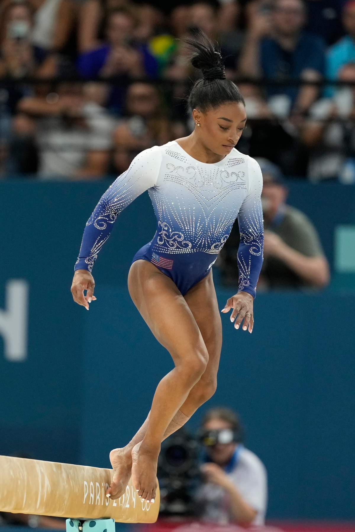 Simone Biles, of the United States, falls during the women’s artistic gymnastics individual balance beam finals at Bercy Arena at the 2024 Summer Olympics, Monday, Aug. 5, 2024, in Paris, France.