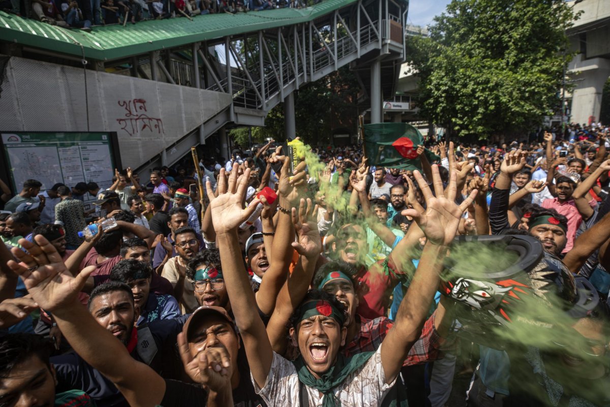 Protesters shout slogans as they celebrate Prime Minister Sheikh Hasina’s resignation, in Dhaka, Bangladesh, Monday, Aug. 5, 2024. (AP Photo/Rajib Dhar)