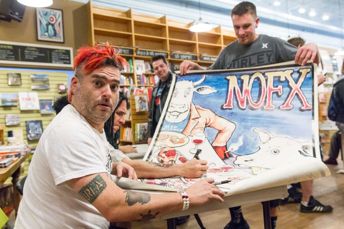 NOFX singer “Fat Mike” Burkett poses as he prepares to sign a fan's poster at a book signing at Parnassus Books in Nashville, Tenn., on Tuesday, April 26, 2016. The punk band is exchanging grimy music venues for highbrow bookstores while promoting their joint autobiography “NOFX: The Hepatitis Bathtub and Other Stories.”