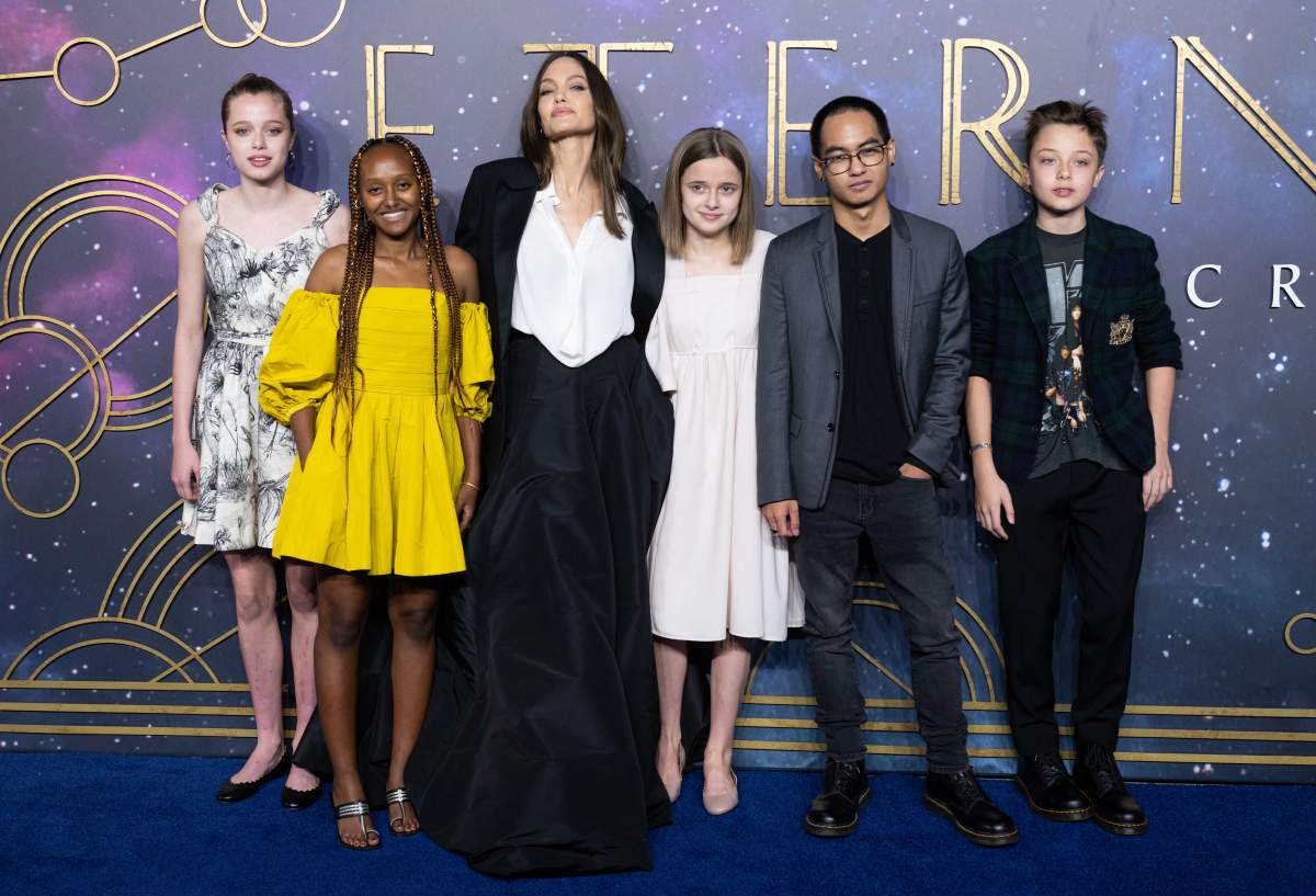 Angelina Jolie stands between her five kids, all in formalwear.