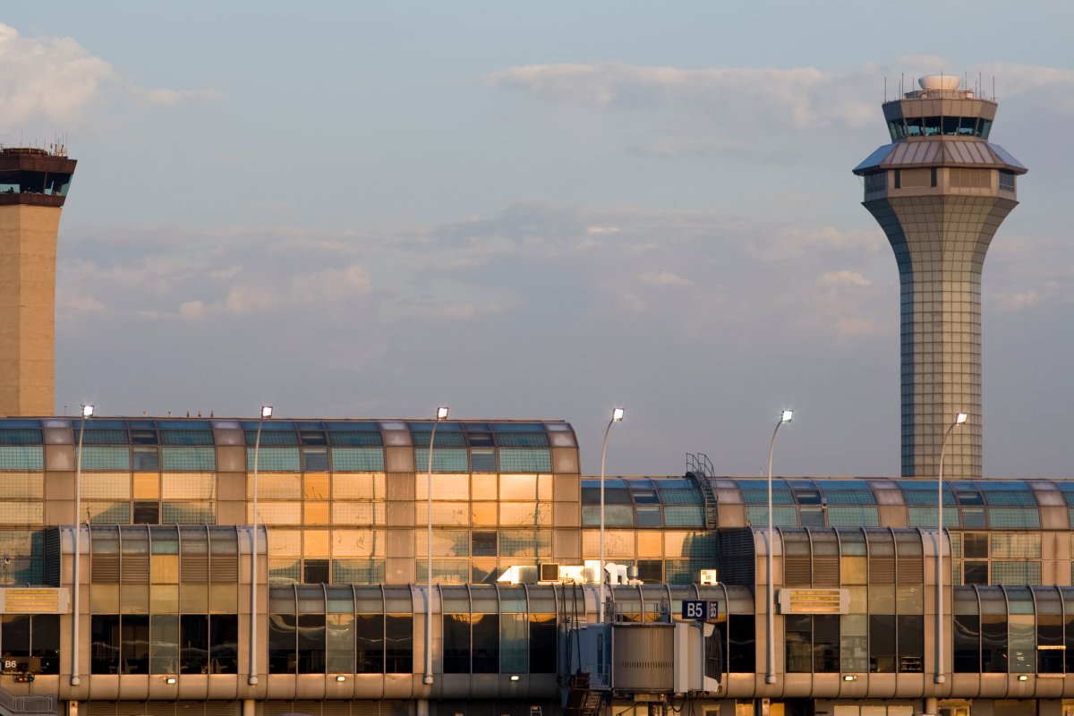 The setting sun reflects off of a terminal building at Chicago's O'Hare Airport in Illinois.