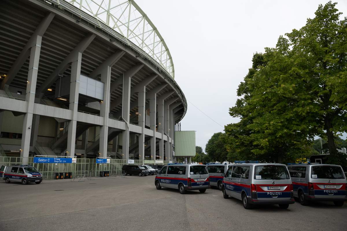 Police cars park outside Ernst Happel Stadium on August 08, 2024 in Vienna, Austria after Austrian law enforcement announced it had foiled a suspected attack on the venue.