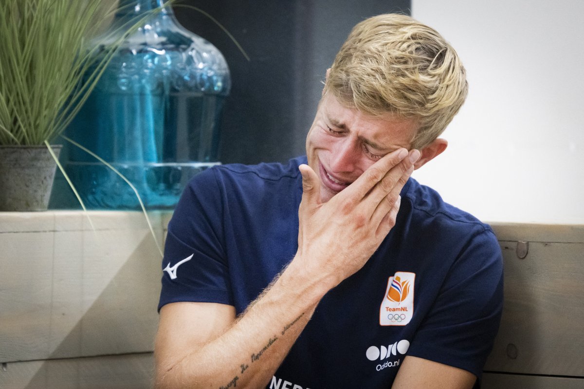 Dutch volleyball player Steven van de Velde wipes away tears as he addresses media representatives during a press conference at the European Beach Volleyball Championships in The Hague on August 13, 2024, following his participation in the 2024 Paris Olympic Games.