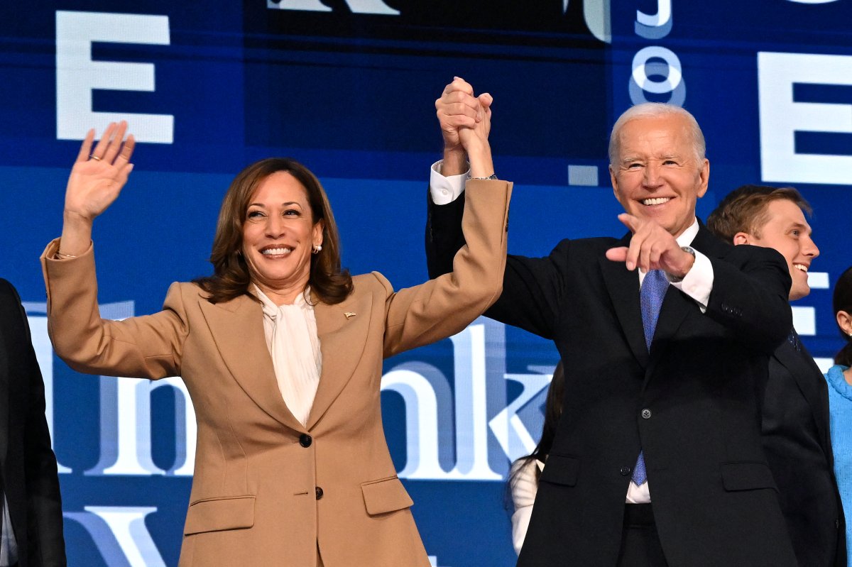 US President Joe Biden holds US Vice President and 2024 Democratic presidential candidate Kamala Harris' hand after delivering the keynote address on the first day of the Democratic National Convention (DNC) at the United Center in Chicago, Illinois, on August 19, 2024.