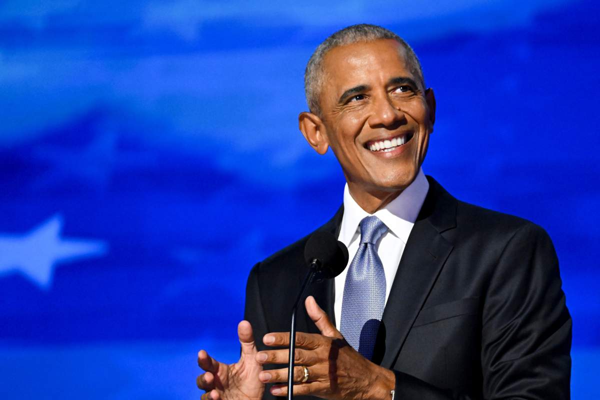 Former US President Barack Obama holds his hands a couple inches apart as he speaks during the Democratic National Convention (DNC) at the United Center in Chicago.