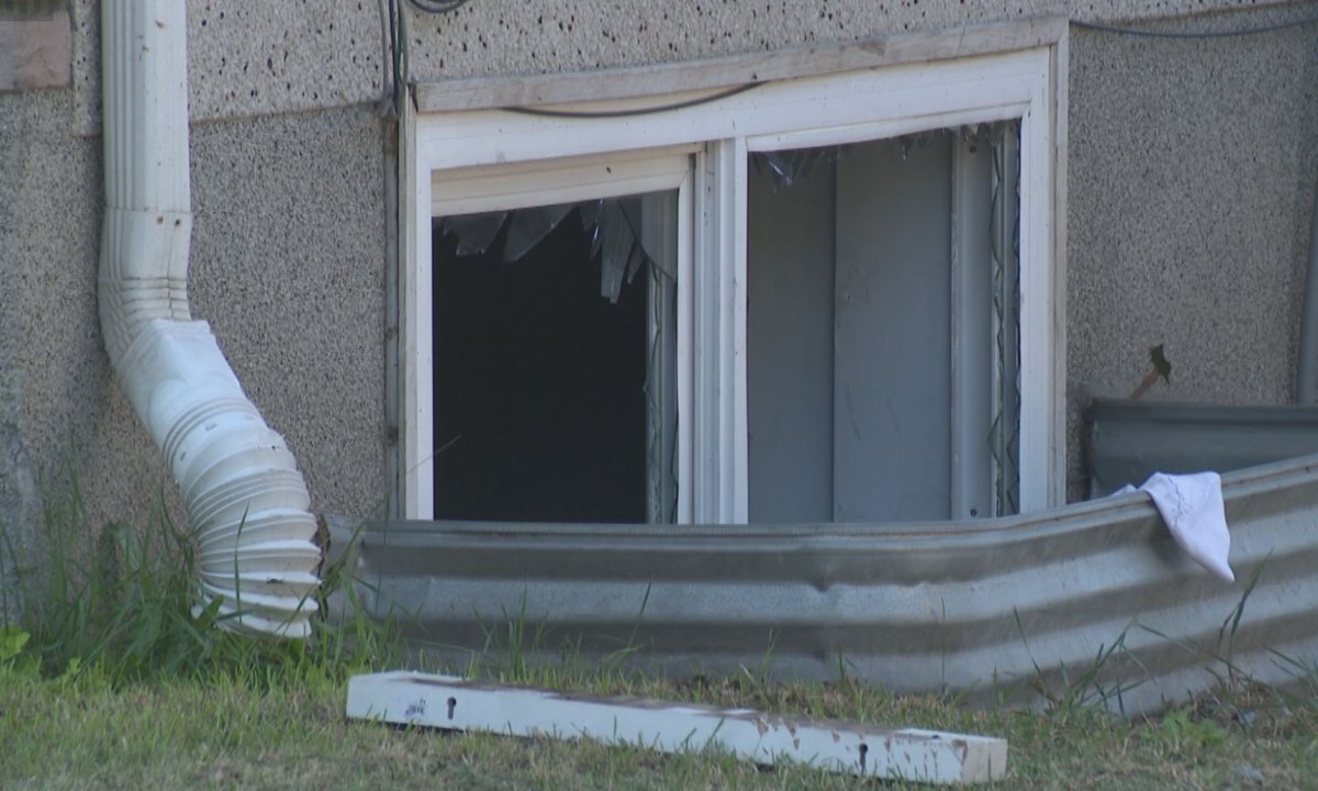 The basement window that fire crews broke to help free two trapped people.