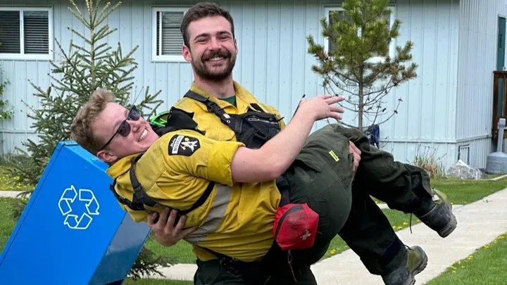 Alberta wildland firefighter Morgan Kitchen and a coworker in an undated photo.