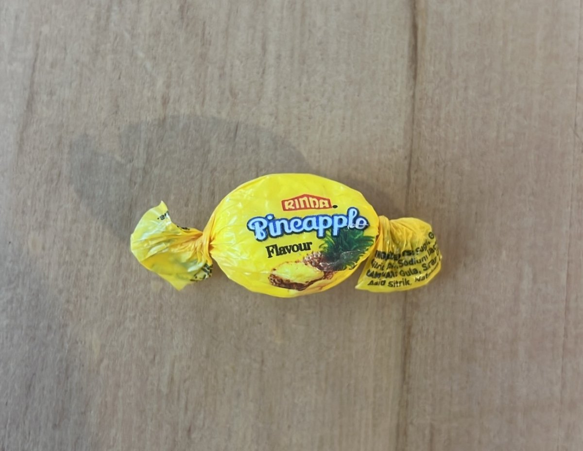 An image of the laced candy wrapped in yellow paper.