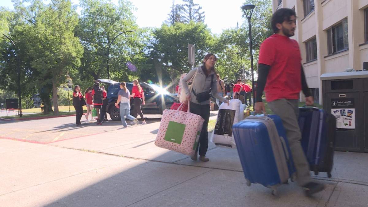Volunteers help first-year students settle in to dorm life a the University of Calgary Sunday.