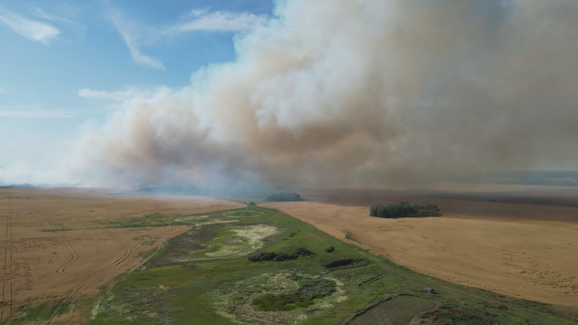 The fire began in a field between Highway 11 and West of Victor Road, but plumes of smoke was seen throughout the city.