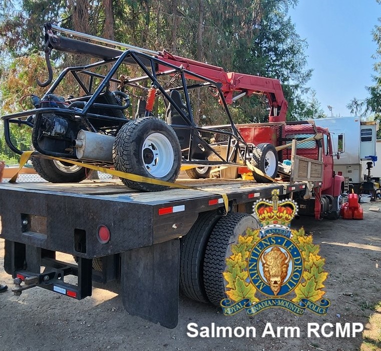 This handout image from Salmon Arm RCMP shows two of three vehicles recovered by police at a residence in Blind Bay on Aug. 15, 2024.