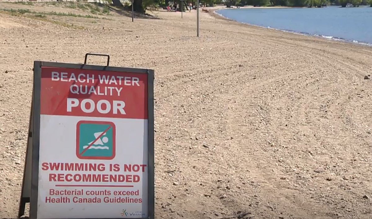 A sign warning swimmers at a Vernon beach of poor water quality.