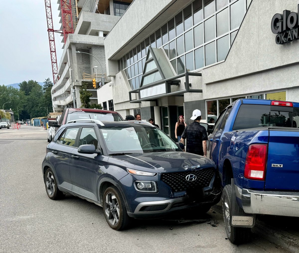 The suspected driver of a truck that crashed into a number of parked vehicles as well as a building in downtown Kelowna was arrested, police say.