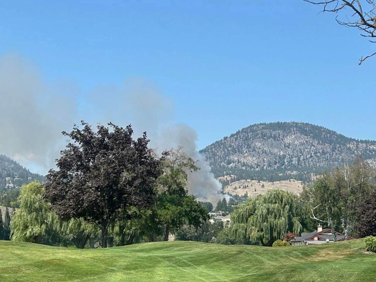 Smoke rises from a wildfire in the West Bench area of Penticton on Tuesday afternoon.