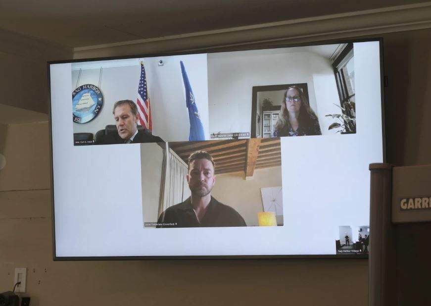 Justin Timberlake, centre, appears by video during his arraignment in Sag Harbor Justice Carl Irace's courtroom on Friday, Aug. 2, 2024 in Sag Harbor, N.Y.