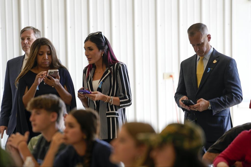 Lynne Patton, Laura Loomer and Corey Lewandowski watch as Republican presidential nominee former President Donald Trump visits the Shanksville Volunteer Fire Company in Shanksville, Pa., Wednesday, Sept. 11, 2024.