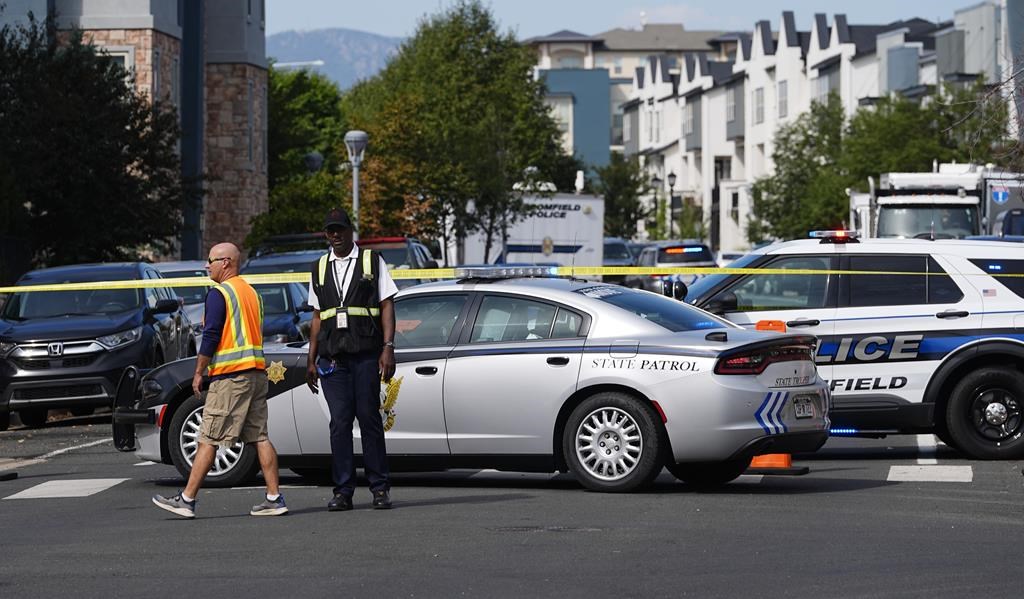 Law enforcement officials at the scene of a shooting in an apartment complex early Thursday, Sept. 12, 2024, in Broomfield, Colo. (AP Photo/David Zalubowski).