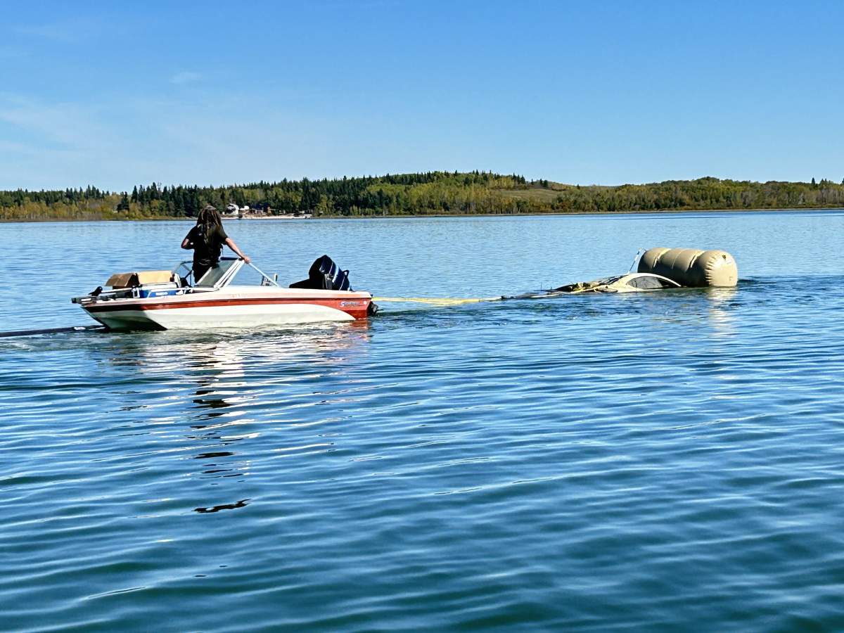 A car submerged in Alberta's Floatingstone Lake removed Tuesday, Sept. 17, 2024.