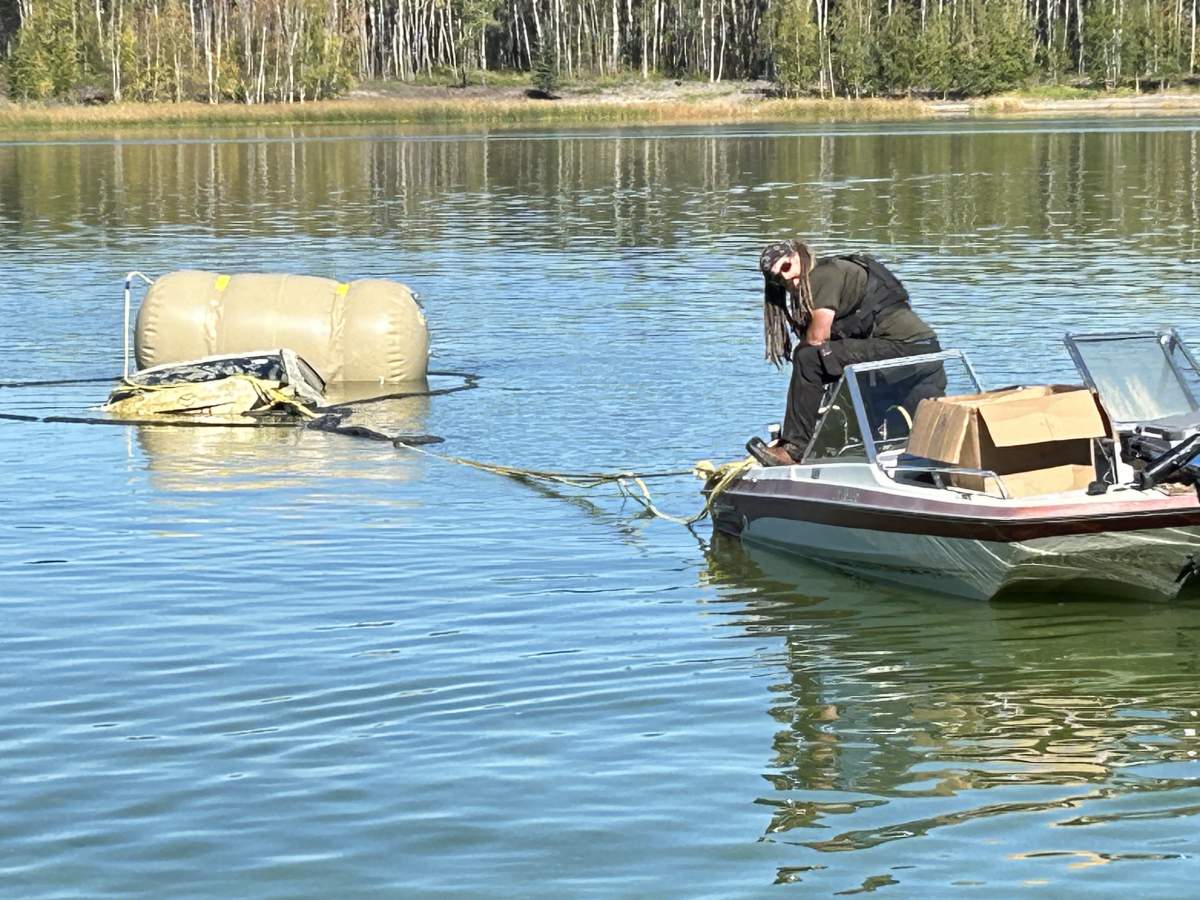 A car submerged in Alberta's Floatingstone Lake removed Tuesday, Sept. 17, 2024.