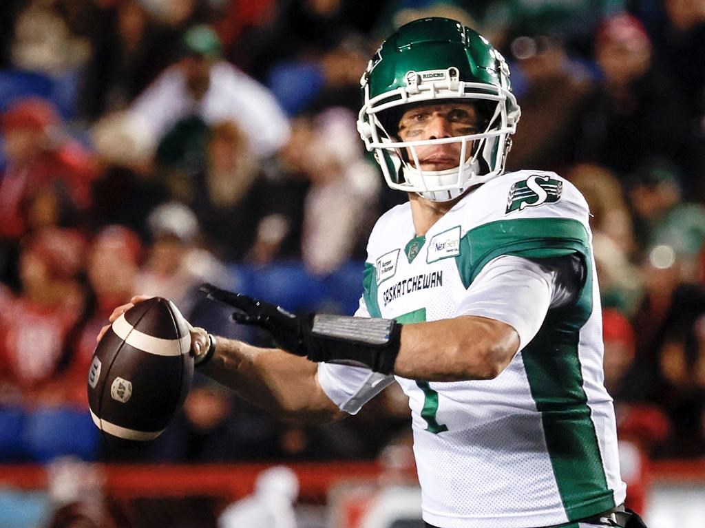 Saskatchewan Roughriders quarterback Trevor Harris (7) looks for a receiver during second half CFL football action against the Calgary Stampeders in Calgary, Friday, Sept. 20, 2024. THE CANADIAN PRESS/Jeff McIntosh.