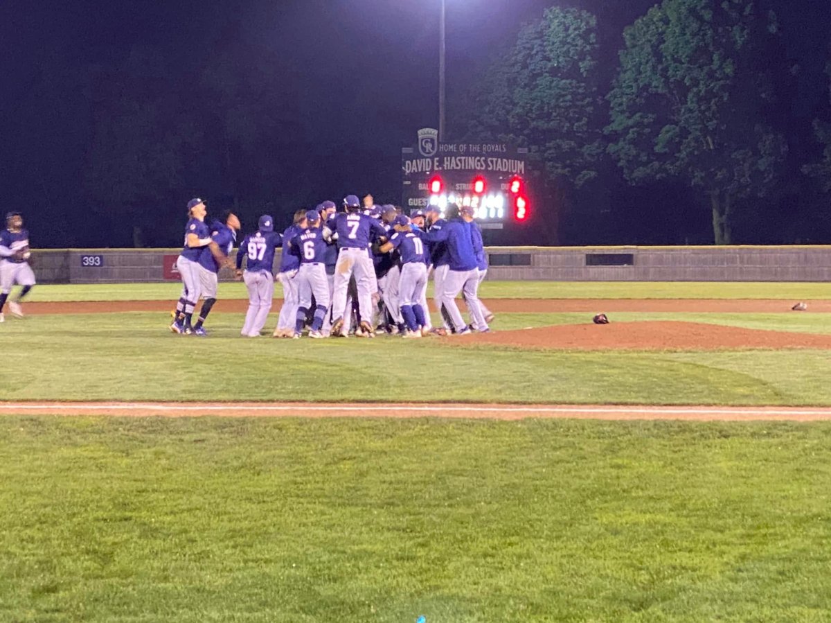 Barrie Baycats celebrate on the field after winning the Intercounty League championship on Saturday night.