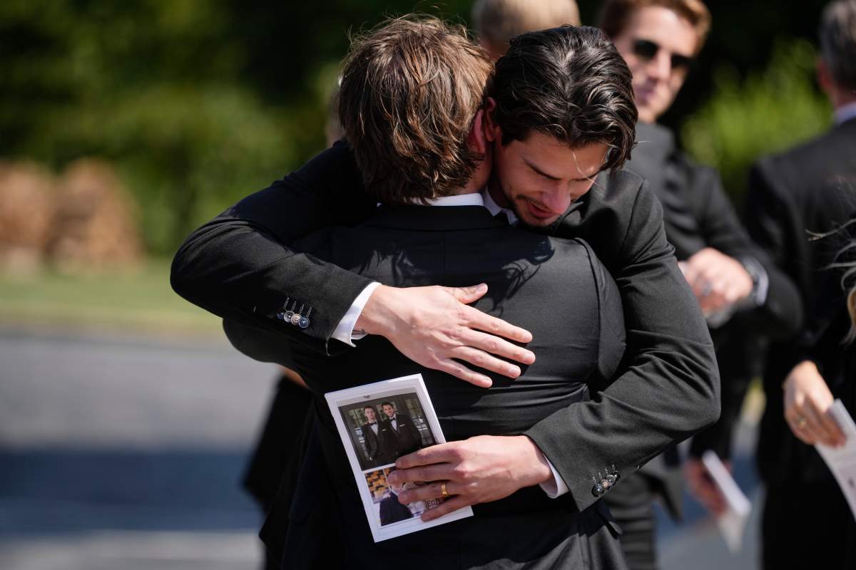 Mourners, including hockey player Sean Monahan, depart following the funeral for Columbus Blue Jackets hockey player John Gaudreau and his brother Matthew Gaudreau at St. Mary Magdalen Catholic Church in Media, Pa., Monday, Sept. 9, 2024.