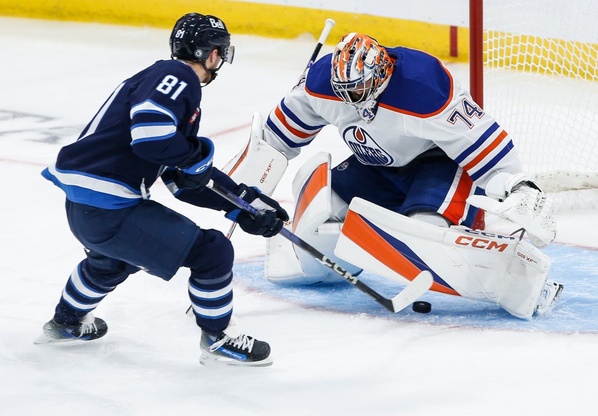 Winnipeg Jets' Kyle Connor (81) scores on Edmonton Oilers goaltender Stuart Skinner (74) during second period NHL pre-season game action in Winnipeg on Wednesday, September 25, 2024. THE CANADIAN PRESS/John Woods.