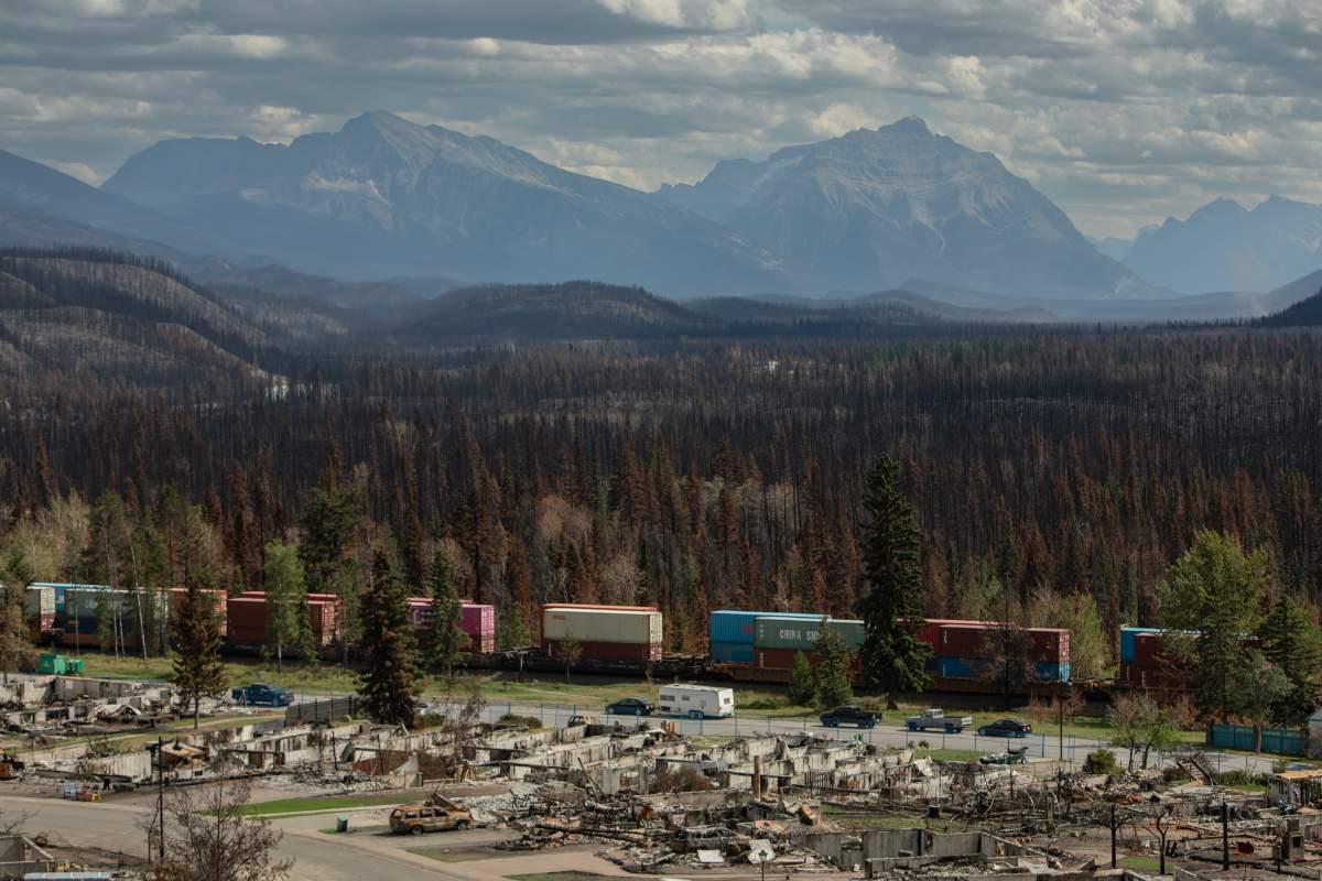 A train passing through the fire-ravaged townsite in Jasper National Park on Monday August 19, 2024.