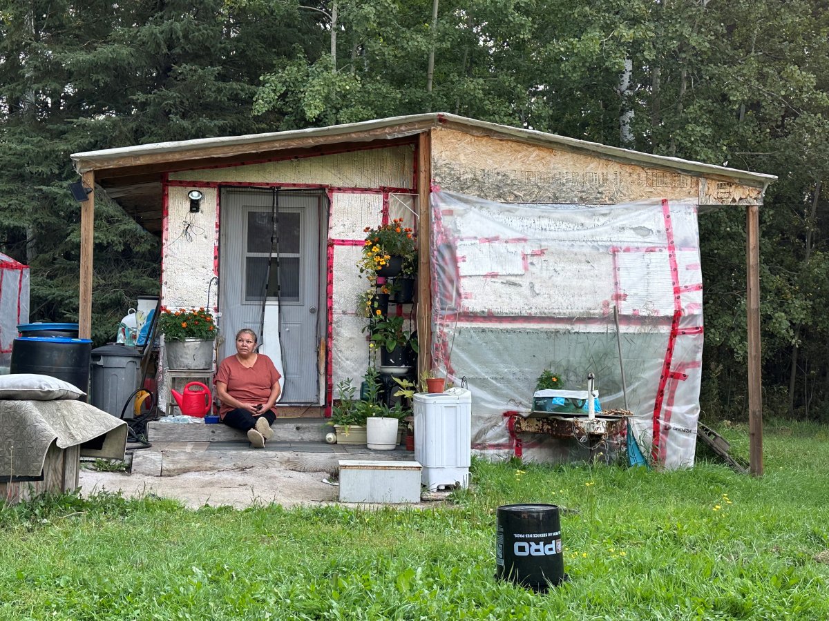 Grace Richards, sits outside her home in Conklin, Alta. in September 2024.