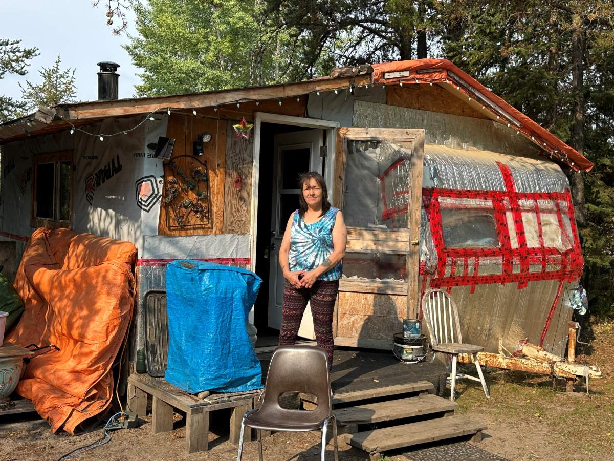 Darlene Richards in front of the home she shares with her daughter in Conklin, Alta. in September 2024.