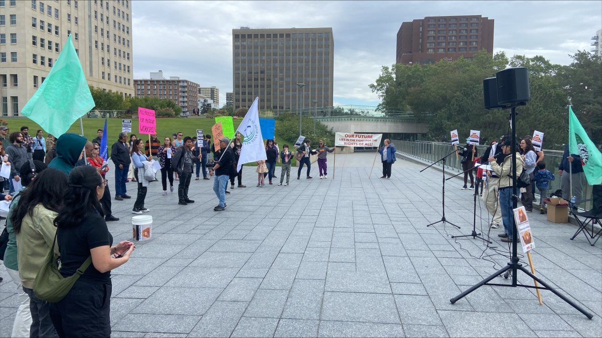 Demonstrators turned up at a rally in downtown Edmonton on Saturday to call on the federal government to take more action to "regularize" undocumented workers in Canada.